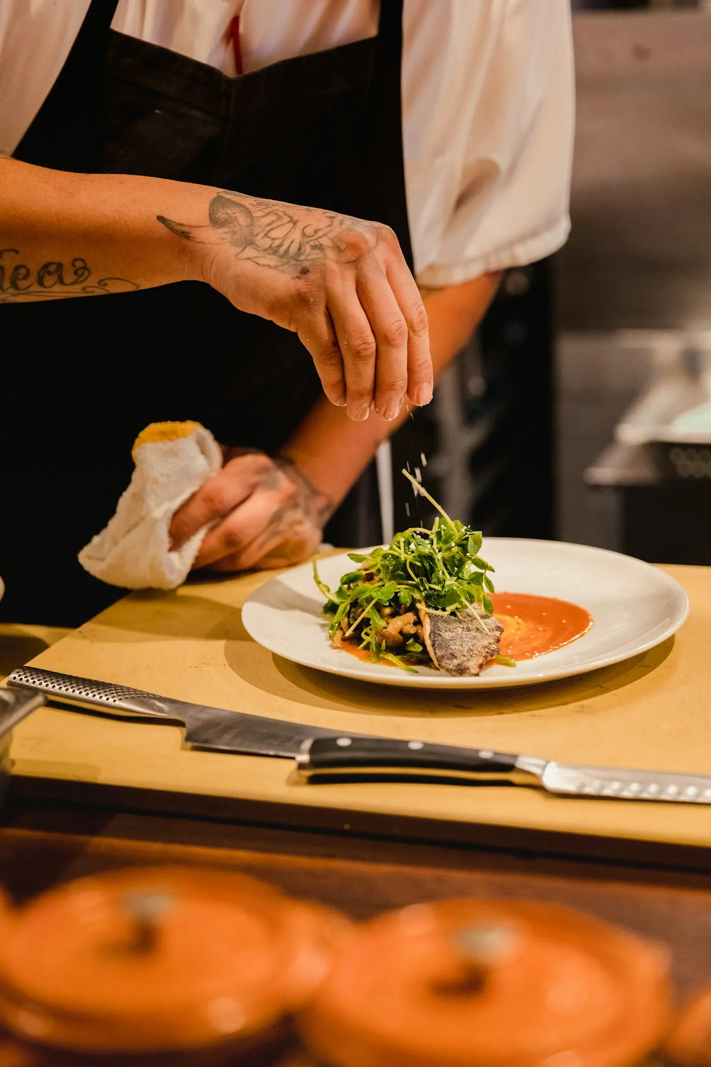 Chef working the line in a busy commercial kitchen