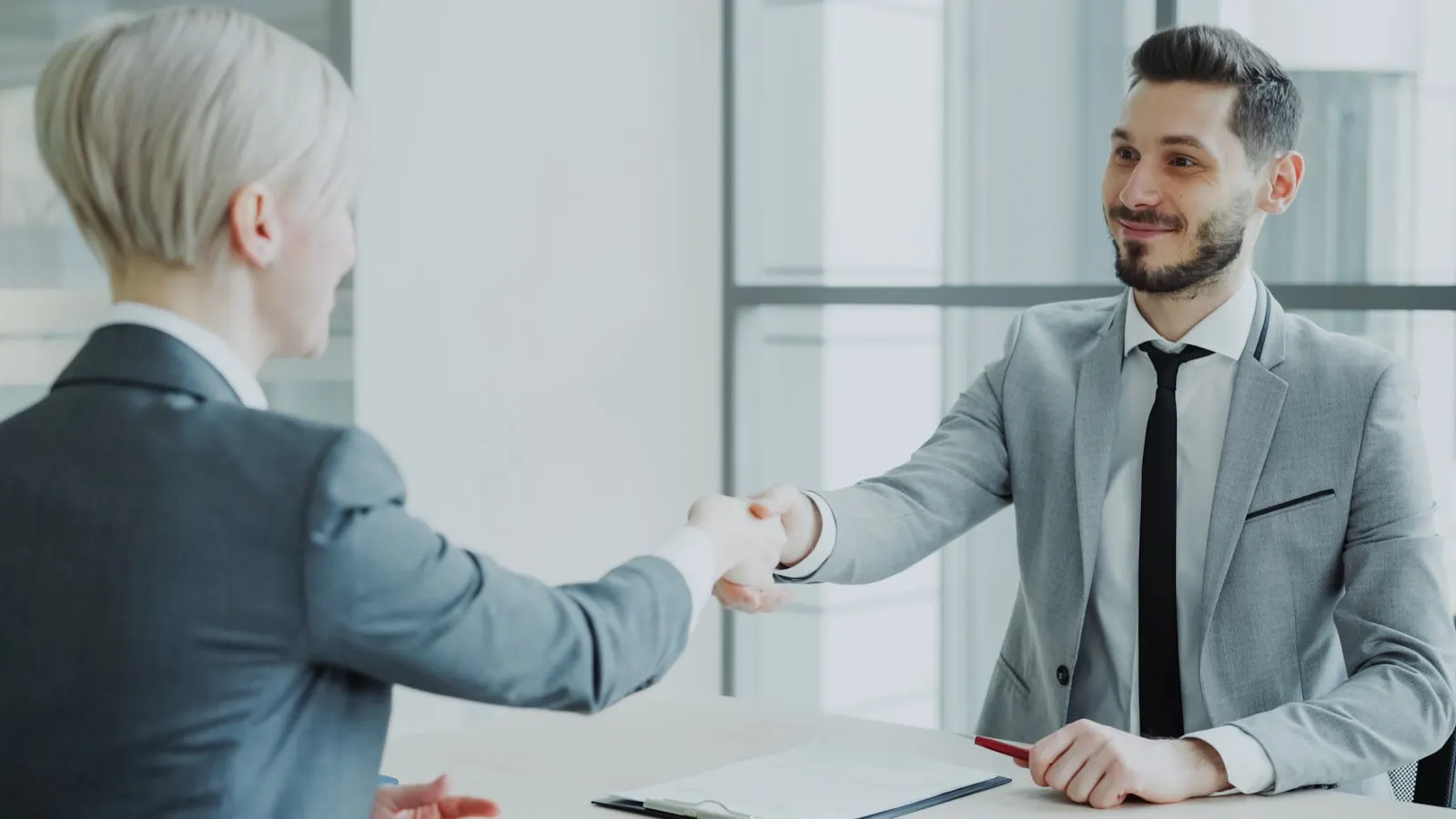 Commercial kitchen manager reviewing a service agreement with a contractor