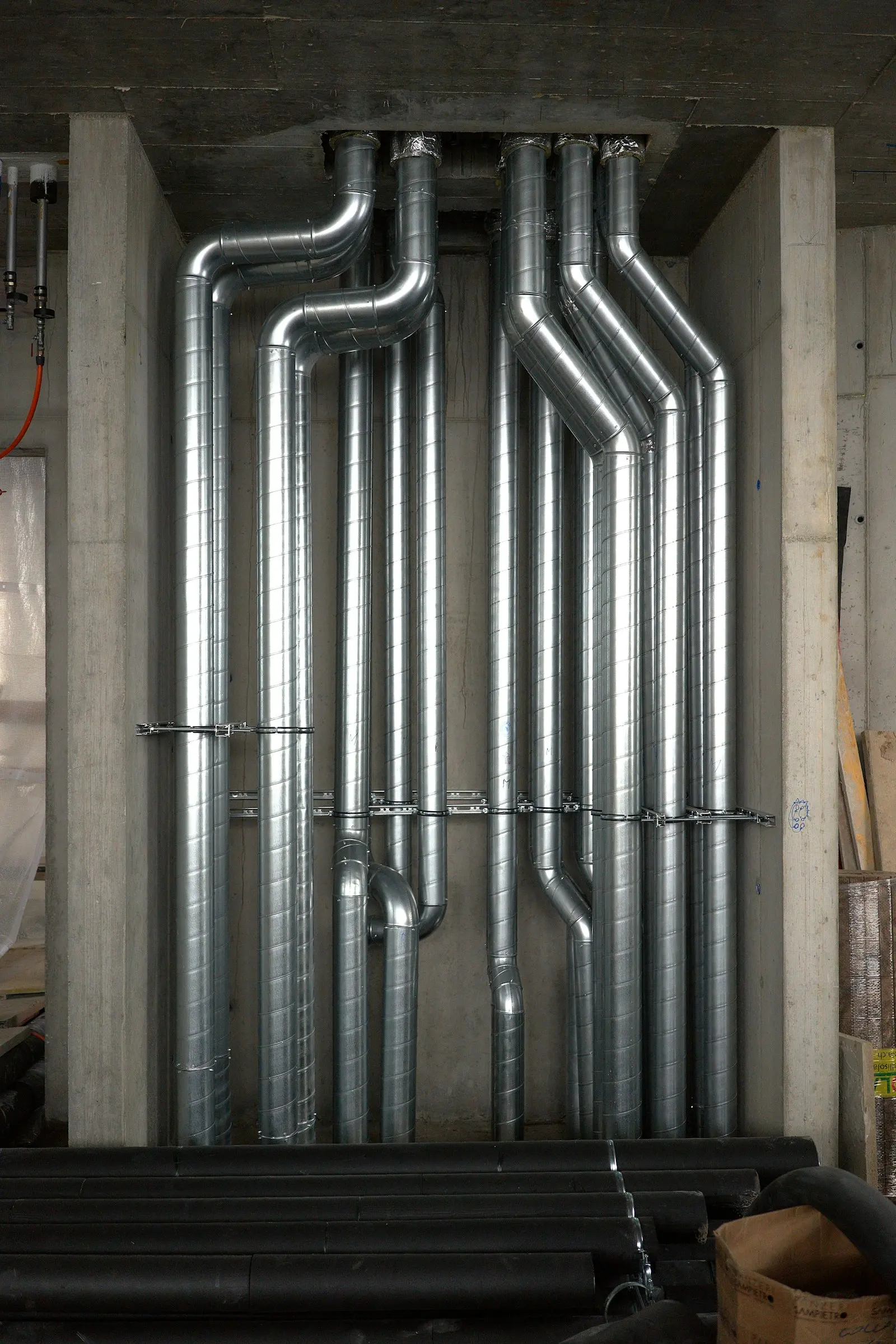 Clean galvanised exhaust ductwork running through a commercial ceiling void after cleaning
