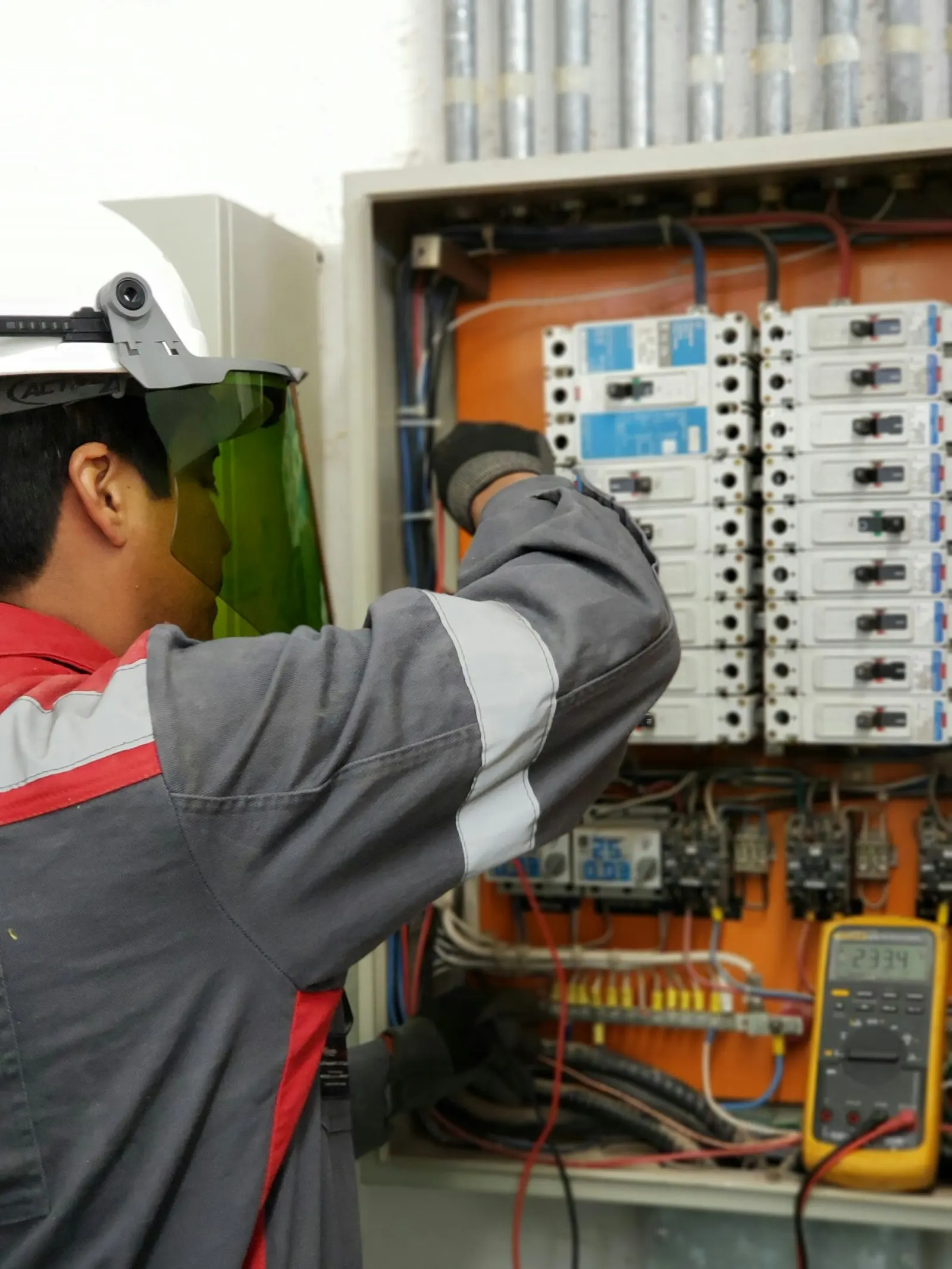 Maintenance technician inspecting mechanical plant on a commercial site